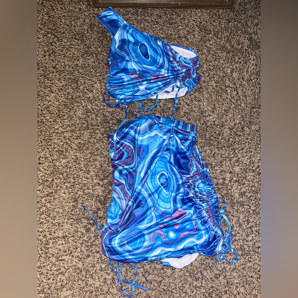 Blue 2 piece set. Cropped shirt and adjustable skirt.